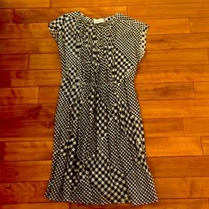 Black and white casual dress. Needs camisole. Size med. excellent condition.